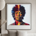 Framed artwork of a colorful portrait of Jimi Hendrix on a wall above a sofa.