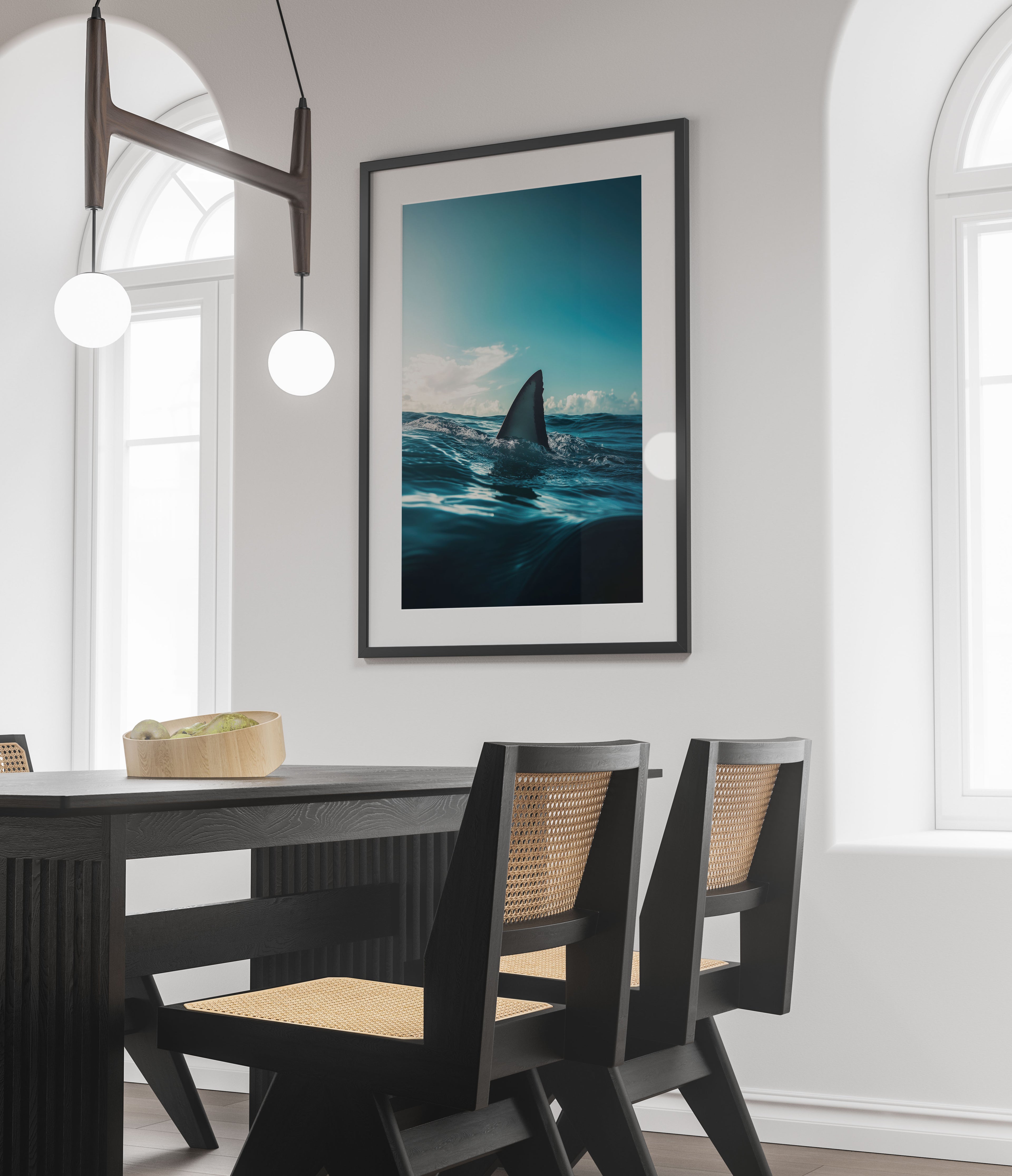 Shark fin wall art framed photo of a shark fin emerging from the ocean hanging in modern dining room